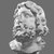  <em>Head from a Statuette of Zeus Serapis</em>, 1st century C.E. Faience, 3 7/8 x 2 7/8 x 2 3/8 in. (9.8 x 7.3 x 6 cm). Brooklyn Museum, Charles Edwin Wilbour Fund, 58.79.1. Creative Commons-BY (Photo: Brooklyn Museum, CUR.58.79.1_NegD_print_bw.jpg)