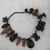 Tukano. <em>Charm Necklace</em>, mid-20th century. Palm nut, seeds, plant fiber, 6 1/4 × 3/4 × 8 1/4 in. (15.9 × 1.9 × 21 cm). Brooklyn Museum, Gift of E.R. Squibb and Sons, 61.89. Creative Commons-BY (Photo: Brooklyn Museum, CUR.61.89_view1.jpg)