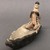 Karaja. <em>Figurine Seated in Canoe with Fish</em>, ca. mid-20th century. Ceramic, pigment, 4 7/8 x 2 1/2 x 10 5/8 in. (12.4 x 6.4 x 27 cm). Brooklyn Museum, Gift of Ingeborg de Beausacq, 62.180.25. Creative Commons-BY (Photo: Brooklyn Museum, CUR.62.180.25_view01.jpg)