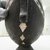 Makira Islander. <em>Bird Bowl (Apira Ni Mwane)</em>, early 20th century. Wood, nautilus shell, parinarium nut paste, 7 x 16 1/4 x 6 1/4 in. (17.8 x 41.3 x 15.9 cm). Brooklyn Museum, Carll H. de Silver Fund, 62.29. Creative Commons-BY (Photo: , CUR.62.29_detail04.jpg)