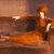 Guy Pène du Bois (American, 1884-1958). <em>Woman on Sofa</em>, ca. 1922-1927. Oil on panel, 26 x 31 in. (66 x 78.7 cm). Brooklyn Museum, Gift of Chester Dale, 63.148.1. © artist or artist's estate (Photo: Brooklyn Museum, CUR.63.148.1.jpg)