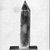  <em>Obelisk</em>, ca. 1075-332 B.C.E. Glass, 2 5/16 × 11/16 × 11/16 in. (5.9 × 1.8 × 1.8 cm). Brooklyn Museum, Charles Edwin Wilbour Fund, 65.134.2. Creative Commons-BY (Photo: Brooklyn Museum, CUR.65.134.2_NegA_inverted_bw.jpg)
