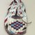 Sioux. <em>Moccasin with red, white, blue and black geometric beadwork</em>, 1901-1966. Beads, cotton thread, hide, 7 3/4 x 3 1/2 x 3/4 in. or (19.0 cm). Brooklyn Museum, Gift of Mr. and Mrs. Jerome Blum, 66.86.24. Creative Commons-BY (Photo: Brooklyn Museum, CUR.66.86.24_view1.jpg)
