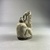  <em>Ape Holding a Vessel</em>, 7th–6th century B.C.E. Faience, 3 11/16 x 1 9/16 x 2 5/16 in. (9.3 x 4 x 5.8 cm). Brooklyn Museum, Charles Edwin Wilbour Fund, 67.1. Creative Commons-BY (Photo: Brooklyn Museum, CUR.67.1_left.JPG)