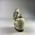  <em>Ape Holding a Vessel</em>, 7th–6th century B.C.E. Faience, 3 11/16 x 1 9/16 x 2 5/16 in. (9.3 x 4 x 5.8 cm). Brooklyn Museum, Charles Edwin Wilbour Fund, 67.1. Creative Commons-BY (Photo: Brooklyn Museum, CUR.67.1_threequarter.JPG)