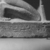  <em>Senenmut</em>, ca. 1478-1458 B.C.E. Granodiorite with granite vein, 18 3/4 × 7 × 11 1/2 in., 67.5 lb. (47.6 × 17.8 × 29.2 cm, 30.62kg). Brooklyn Museum, Charles Edwin Wilbour Fund, 67.68. Creative Commons-BY (Photo: Brooklyn Museum, CUR.67.68_NegP_print_bw.jpg)