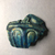  <em>Vessel Fragment</em>, 305 B.C.E.–395 C.E. Faience, 2 3/8 x 2 11/16 in. (6 x 6.9 cm). Brooklyn Museum, Anonymous gift, 69.112.22. Creative Commons-BY (Photo: , CUR.69.112.22_view01.jpg)