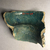  <em>Vessel Fragment</em>, 305 B.C.E.-395 C.E. Faience, 3 13/16 x 4 5/16 in. (9.7 x 11 cm). Brooklyn Museum, Anonymous gift, 69.112.23. Creative Commons-BY (Photo: , CUR.69.112.23_view02.jpg)