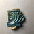  <em>Vessel Fragment</em>, 305 B.C.E.–395 C.E. Faience, 2 3/16 x 1 15/16 in. (5.6 x 5 cm). Brooklyn Museum, Anonymous gift, 69.112.32. Creative Commons-BY (Photo: , CUR.69.112.32_view01.jpg)