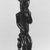 Baule. <em>Male Figure Seated on a Stool</em>, late 19th or early 20th century. Wood, glass beads, 19 x 4 3/4 x 4 1/2 in. (48.3 x 12.1 x 11.4 cm). Brooklyn Museum, By exchange, 69.39.4. Creative Commons-BY (Photo: Brooklyn Museum, CUR.69.39.4_print_threequarter_bw.jpg)