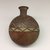 Wari. <em>Ceramic Bottle</em>, 600-1000. Ceramic, pigment, 6 × 4 7/8 × 2 3/4 in. (15.2 × 12.4 × 7 cm). Brooklyn Museum, Gift of Ernest Erickson, 70.177.67. Creative Commons-BY (Photo: , CUR.70.177.67_view01.jpg)