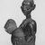 Yorùbá. <em>Kneeling Female Figure Holding Bowl with Face</em>, late 19th or early 20th century. Wood, applied materials, 12 x bowl: 3 x lid:  5 1/2 in. (30.0 x 7.5 x 14.0 cm). Brooklyn Museum, Gift of Dr. and Mrs. Abbott A. Lippman, 71.177.4a-b. Creative Commons-BY (Photo: Brooklyn Museum, CUR.71.177.4_print_threequarter_bw.jpg)
