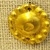 Greek. <em>Circular Piece of Sheet Gold, Perhaps a Central Boss for a Large Rosette</em>, late 4th century B.C.E. Gold, 1/16 x 1/2 in. (0.2 x 1.3 cm). Brooklyn Museum, Gift of Mr. and Mrs. Thomas S. Brush, 71.79.116. Creative Commons-BY (Photo: Brooklyn Museum, CUR.71.79.116_overall.jpg)