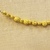Greek. <em>Melon Shaped Bead Pierced Lengthwised with Plain Rim</em>, late 4th century B.C.E. Gold, 3/16 x 1/4 in. (0.5 x 0.6 cm). Brooklyn Museum, Gift of Mr. and Mrs. Thomas S. Brush, 71.79.65. Creative Commons-BY (Photo: Brooklyn Museum, CUR.71.79.56-.76_detail01.jpg)