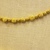 Greek. <em>Melon Shaped Bead Pierced Lengthwised with Beaded Rim</em>, late 4th century B.C.E. Gold, 1/4 x 3/8 in. (0.6 x 0.9 cm). Brooklyn Museum, Gift of Mr. and Mrs. Thomas S. Brush, 71.79.61. Creative Commons-BY (Photo: Brooklyn Museum, CUR.71.79.56-.76_detail02.jpg)