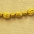 Greek. <em>Melon Shaped Bead Pierced Lengthwised with Beaded Rim</em>, late 4th century B.C.E. Gold, 1/4 x 5/16 in. (0.7 x 0.8 cm). Brooklyn Museum, Gift of Mr. and Mrs. Thomas S. Brush, 71.79.60. Creative Commons-BY (Photo: Brooklyn Museum, CUR.71.79.56-.76_detail07.jpg)