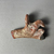 Coptic. <em>Fragment in Shape of a Bird</em>. Clay, pigment, 2 11/16 × 3 1/4 × 1 1/8 in. (6.8 × 8.2 × 2.8 cm). Brooklyn Museum, Anonymous gift, 74.46.1. Creative Commons-BY (Photo: Brooklyn Museum, CUR.74.46.1_back.JPG)