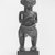 Attributed to Satshombo. <em>Female Figure with Child</em>, late 19th or early 20th century. Wood, fiber, plastic, 10 3/4 x 4 x 3 1/4in. (27.3 x 10.2 x 8.3cm). Brooklyn Museum, Gift of Marcia and John Friede, 74.66.4. Creative Commons-BY (Photo: Brooklyn Museum, CUR.74.66.4_print_front_bw.jpg)