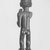 Chokwe. <em>Female Figure with Horn (Kaponya)</em>, late 19th century. Wood, copper alloy, 12 1/4 x 3 1/2 x 3 1/4 in. (31.1 x 8.9 x 8.3 cm). Brooklyn Museum, Gift of Marcia and John Friede, 74.89. Creative Commons-BY (Photo: Brooklyn Museum, CUR.74.89_print_back_bw.jpg)