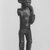 Chokwe. <em>Female Figure with Horn (Kaponya)</em>, late 19th century. Wood, copper alloy, 12 1/4 x 3 1/2 x 3 1/4 in. (31.1 x 8.9 x 8.3 cm). Brooklyn Museum, Gift of Marcia and John Friede, 74.89. Creative Commons-BY (Photo: Brooklyn Museum, CUR.74.89_print_front_bw.jpg)