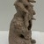 Jama-Coaque. <em>Seated Figure</em>, 500 B.C.E.–C.E.500. Ceramic, pigment?, 9 × 5 × 4 3/4 in. (22.9 × 12.7 × 12.1 cm). Brooklyn Museum, Gift of Egizia Modiano, 76.166.3. Creative Commons-BY (Photo: Brooklyn Museum photgoraph, CUR.76.166.3_right.JPG)