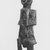 Kota. <em>Standing Reliquary Guardian Figure</em>, late 19th-early 20th century. Wood, copper alloy, 13 5/8 x 3 3/4 x 3 in. (34.6 x 9.5 x 7.5 cm). Brooklyn Museum, Gift of Marcia and John Friede, 78.239.2. Creative Commons-BY (Photo: Brooklyn Museum, CUR.78.239.2_print_threequarter_bw.jpg)