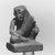 <em>Figurine of an Ithyphallic Male Wearing a Rosette Crown</em>, 664–332 B.C.E. Faience, 1 7/16 × 1 × 3/4 in. (3.6 × 2.6 × 1.9 cm). Brooklyn Museum, Gift of Lucien Viola, 79.175. Creative Commons-BY (Photo: Brooklyn Museum, CUR.79.175_NegL885_9_print_bw.jpg)