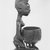 Yorùbá. <em>Kneeling Female Figure Holding a Bowl (Agere Ifa)</em>, late 19th or early 20th century. Wood, applied materials, (metal & beads in bag), h: 11 3/3 in. (30.0 cm). Brooklyn Museum, Gift of Ann W. Walzer, 80.245. Creative Commons-BY (Photo: Brooklyn Museum, CUR.80.245_print_side2_bw.jpg)