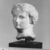 <em>Head of Aphrodite</em>, 332-30 B.C.E. Plaster, 2 13/16 × 1 15/16 × 2 3/16 in. (7.2 × 4.9 × 5.6 cm). Brooklyn Museum, Gift of the Estate of Fenwick W. Wall, 83.28. Creative Commons-BY (Photo: Brooklyn Museum, CUR.83.28_NegB_print_bw.jpg)