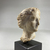  <em>Head of Aphrodite</em>, 332-30 B.C.E. Plaster, 2 13/16 × 1 15/16 × 2 3/16 in. (7.2 × 4.9 × 5.6 cm). Brooklyn Museum, Gift of the Estate of Fenwick W. Wall, 83.28. Creative Commons-BY (Photo: Brooklyn Museum, CUR.83.28_view03.jpg)