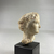  <em>Head of Aphrodite</em>, 332-30 B.C.E. Plaster, 2 13/16 × 1 15/16 × 2 3/16 in. (7.2 × 4.9 × 5.6 cm). Brooklyn Museum, Gift of the Estate of Fenwick W. Wall, 83.28. Creative Commons-BY (Photo: Brooklyn Museum, CUR.83.28_view05.jpg)