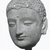  <em>Head of the Buddha</em>, 4th-5th century. Grey stucco with traces of polychrome, height: 9 1/2 in. (24 cm). Brooklyn Museum, Gift of Mr. and Mrs. Richard A. Bertocci, 84.131. Creative Commons-BY (Photo: Brooklyn Museum, CUR.84.131_view2_bw.jpg)