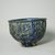 Hasan Al-Qashani. <em>Octagonal Bowl with Inscriptions</em>, late 12th century. Ceramic; fritware, with carved and molded decoration under a cobalt blue glaze, 4 5/16 x 6 3/8 in. (11 x 16.2 cm). Brooklyn Museum, Gift of the Ernest Erickson Foundation, Inc., 86.227.89. Creative Commons-BY (Photo: Brooklyn Museum, CUR.86.227.89_view5.jpg)