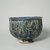 Hasan Al-Qashani. <em>Octagonal Bowl with Inscriptions</em>, late 12th century. Ceramic; fritware, with carved and molded decoration under a cobalt blue glaze, 4 5/16 x 6 3/8 in. (11 x 16.2 cm). Brooklyn Museum, Gift of the Ernest Erickson Foundation, Inc., 86.227.89. Creative Commons-BY (Photo: Brooklyn Museum, CUR.86.227.89_view6.jpg)