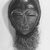 Ngbaka. <em>Mask</em>, 20th century. Wood, raffia fiber and cloth, 16 1/2 x 8 3/4 x 4 1/2 in. (42.0 x 22.2 x 11.5 cm). Brooklyn Museum, Gift of Dr. and Mrs. Abbott A. Lippman, 87.217.1. Creative Commons-BY (Photo: Brooklyn Museum, CUR.87.217.1_print_bw.jpg)