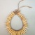 Possibly Kaapor. <em>Necklace</em>, 20th century. Animal teeth, plant fiber, 8 × 6 1/4 × 1/2 in. (20.3 × 15.9 × 1.3 cm), not including ties. Brooklyn Museum, Anonymous gift, 88.89.4. Creative Commons-BY (Photo: Brooklyn Museum, CUR.88.89.4_view01.jpg)