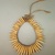 Possibly Kaapor. <em>Necklace</em>, 20th century. Animal teeth, plant fiber, 8 × 6 1/4 × 1/2 in. (20.3 × 15.9 × 1.3 cm), not including ties. Brooklyn Museum, Anonymous gift, 88.89.4. Creative Commons-BY (Photo: Brooklyn Museum, CUR.88.89.4_view02.jpg)