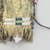 Sioux. <em>Fringed and Beaded Shirt</em>, late 19th century. Hide, beads, pigment, hair bundles, bells, wool, and feather remnants, 48 x 29in. (121.9 x 73.7cm). Brooklyn Museum, Brooklyn Museum Collection, X731.4. Creative Commons-BY (Photo: Brooklyn Museum, CUR.X731.4_view4.jpg)