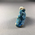  <em>One Figure of a Male</em>, 305-30 B.C.E. Faience, 1 9/16 x 2 3/8 x 13/16 in. (4 x 6.1 x 2.1 cm). Brooklyn Museum, Brooklyn Museum Collection, X865.3. Creative Commons-BY (Photo: , CUR.X865.3_view06.jpg)
