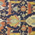  <em>Shield-Varient Carpet</em>, mid 18th–early 19th century. Wool and silk, Ghiordes knot: field, white, light blue, yellow on dark blue ground; border, yellow and green on red ground, 129 x 73 in.  (327.7 x 185.4 cm). Brooklyn Museum, Gift of the Ernest Erickson Foundation, Inc., 86.227.116. Creative Commons-BY (Photo: Brooklyn Museum, CUR_86.227.116_detail019.JPG)