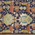  <em>Shield-Varient Carpet</em>, mid 18th–early 19th century. Wool and silk, Ghiordes knot: field, white, light blue, yellow on dark blue ground; border, yellow and green on red ground, 129 x 73 in.  (327.7 x 185.4 cm). Brooklyn Museum, Gift of the Ernest Erickson Foundation, Inc., 86.227.116. Creative Commons-BY (Photo: Brooklyn Museum, CUR_86.227.116_detail051.JPG)