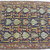  <em>Shield-Varient Carpet</em>, mid 18th–early 19th century. Wool and silk, Ghiordes knot: field, white, light blue, yellow on dark blue ground; border, yellow and green on red ground, 129 x 73 in.  (327.7 x 185.4 cm). Brooklyn Museum, Gift of the Ernest Erickson Foundation, Inc., 86.227.116. Creative Commons-BY (Photo: Brooklyn Museum, CUR_86.227.116_detail053.JPG)