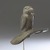 Hopewell. <em>Eagle Platform Pipe</em>, 1-400 C.E. Stone, lead eyes, 3 3/8 x 1 3/16 x 4 5/16 in. (8.6 x 3.0 x 11.0 cm). Anonymous loan, L49.3.1. Creative Commons-BY (Photo: Brooklyn Museum, L49.3.1_threequarter_right_PS9.jpg)