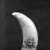 Unknown. <em>Scrimshaw, Whale's Tooth</em>, ca. 1830-1870. Whale's tooth, 5 5/8 x 2 1/8 in. (14.3 x 5.4 cm). Brooklyn Museum, Brooklyn Museum Collection, X613.2. Creative Commons-BY (Photo: Brooklyn Museum, X613.2_side1_bw_SL4.jpg)