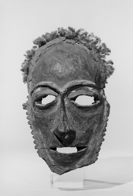 Tolai. <em>Lor Mask</em>, 19th century. Frontal bones of human skull, parinarium nut paste, clay, wood, human hair, fiber, pigment, 8 3/8 x 5 3/4 x 3 1/4 in. (21.3 x 14.6 x 8.3 cm). Brooklyn Museum, Gift of Dr. Clark Burnham, 01.1521. Creative Commons-BY (Photo: Brooklyn Museum, 01.1521_view1_acetate_bw.jpg)