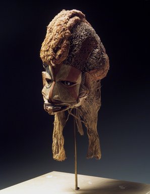  <em>Mask (Tatanua)</em>, 19th century. Wood, rattan, barkcloth, fiber, tapestry turban snail (Turbo petholatus) opercula, seeds, pigment, 21 × 10 × 14 in. (53.3 × 25.4 × 35.6 cm). Brooklyn Museum, Brooklyn Museum Collection, 01.74. Creative Commons-BY (Photo: Brooklyn Museum, 01.74.jpg)