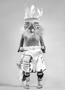Mau-i (She-we-na (Zuni Pueblo)). <em>Kachina Doll (Iselele)</em>, late 19th-early 20th century. Wood, pigment, fur, feathers, cotton, wool, 13 x 4 15/16 x 3 11/16in. (33 x 12.6 x 9.4cm). Brooklyn Museum, Museum Expedition 1904, Museum Collection Fund, 04.297.5351. Creative Commons-BY (Photo: Brooklyn Museum, 04.297.5351_bw.jpg)