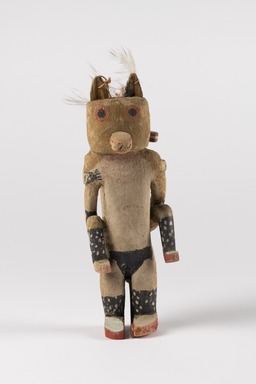 Hopi Pueblo. <em>Kw&egrave;w Tihu (Wolf Kachina Doll)</em>, late 19th century. Cottonwood, pigment, cotton, feather, 9 3/8 &times; 3 1/4 &times; 4 3/8 in. (23.8 &times; 8.3 &times; 11.1 cm). Brooklyn Museum, Museum Expedition 1904, Museum Collection Fund, 04.297.5596. Creative Commons-BY (Photo: Brooklyn Museum, 04.297.5596_front_PS22.jpg)