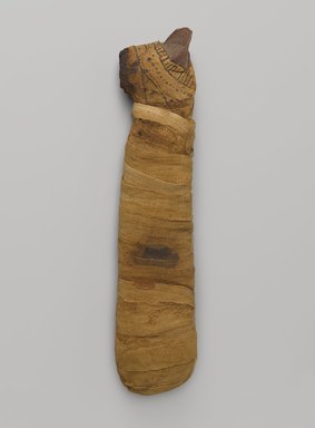  <em>Mummified Cat</em>, 305 B.C.E.–395 C.E. Animal remains, linen, pigment, 14 7/8 × 2 3/4 × 3 3/4 in. (37.8 × 7 × 9.5 cm). Brooklyn Museum, Charles Edwin Wilbour Fund, 05.307. Creative Commons-BY (Photo: Brooklyn Museum, 05.307_PS9.jpg)