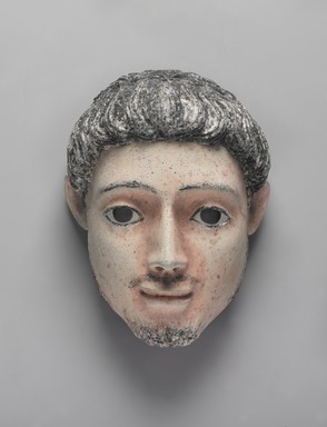  <em>Mummy Mask</em>, 150-200 C.E. Plaster, pigment, 9 7/16 x 7 1/16 x 5 1/2 in. (24 x 18 x 14 cm). Brooklyn Museum, Charles Edwin Wilbour Fund, 05.392. Creative Commons-BY (Photo: , 05.392_PS9.jpg)